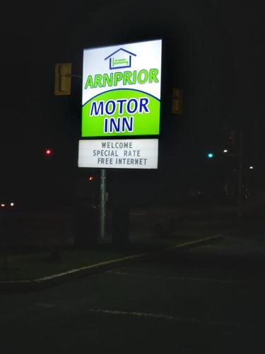 a sign for a motor inn at night at Arnprior Motor Inn in Arnprior