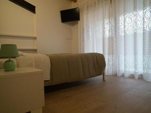Cama o camas de una habitación en Agriturismo Vidalli Colvidor