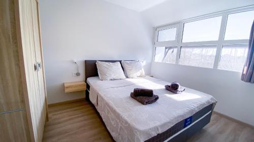 Ένα ή περισσότερα κρεβάτια σε δωμάτιο στο Vakantiewoning Kaviaar