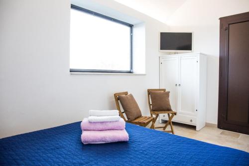 Ένα ή περισσότερα κρεβάτια σε δωμάτιο στο Gioia Infinita