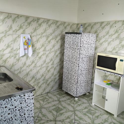 Kuchyň nebo kuchyňský kout v ubytování Quarto Duplo Confort