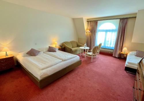 Ένα ή περισσότερα κρεβάτια σε δωμάτιο στο Hotel Monopol Luzern