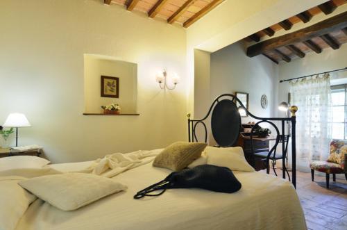 En eller flere senge i et værelse på Agriturismo La Casa Nuova