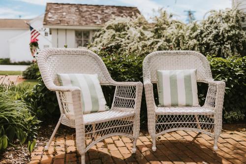 two wicker chairs sitting next to each other at The Rochester Inn in Sheboygan Falls