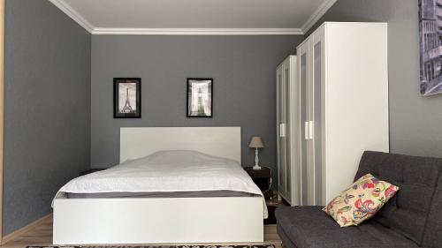 Ένα ή περισσότερα κρεβάτια σε δωμάτιο στο Upes Apartment