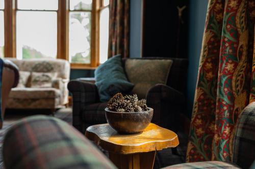 a living room with a bowl on a table at Whitebridge Hotel in Whitebridge