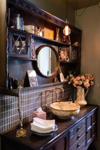 a bathroom with a sink and a mirror at Whitebridge Hotel in Whitebridge