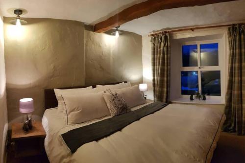מיטה או מיטות בחדר ב-Cranmore House - a walkers' and cyclists' dream