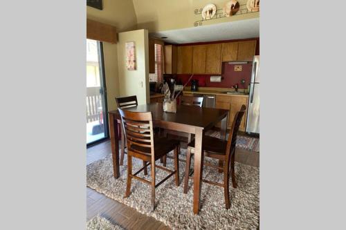a kitchen with a dining room table and chairs at Best creek view and mountain view in town. Unbeatable location in Vail