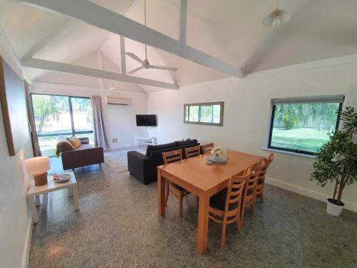 a living room with a table and a couch at Busselton Holiday Units in Busselton