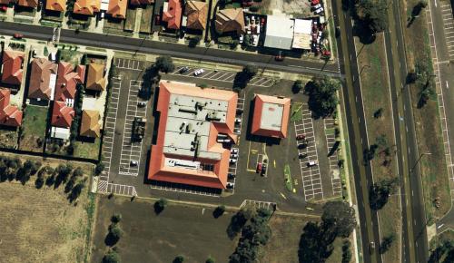 an overhead view of a building in a city at Nightcap at Sylvania Hotel in Campbellfield