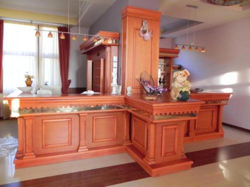 a kitchen with a wooden island in a room at Hotel Lyhnidas in Pogradec