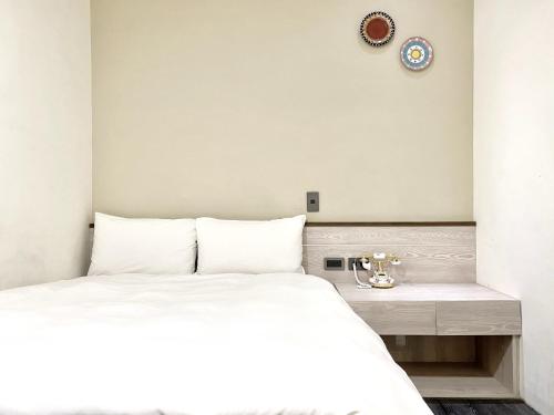 Postel nebo postele na pokoji v ubytování Raise Hotel Taichung