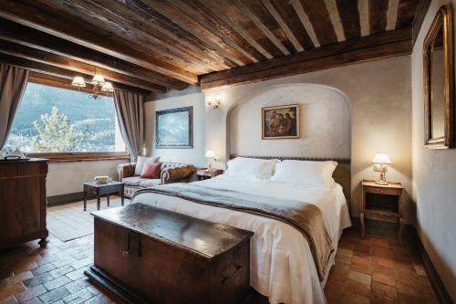 Säng eller sängar i ett rum på Relais Mont Blanc Hotel & Spa