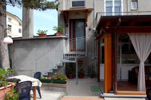 a stairway leading to a house with potted plants at Dallapia in Santa Maria del Piano