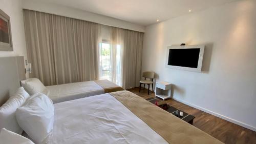 Ένα ή περισσότερα κρεβάτια σε δωμάτιο στο Hotel Cantera Respira Campo
