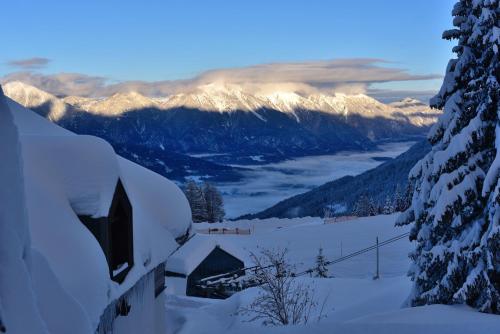 a view of a snowy mountain with snow covered mountains at Apartment Sonnleitn/Nassfeld in Sonnenalpe Nassfeld