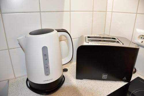 a blender and a toaster on a kitchen counter at Apartment Sonnleitn/Nassfeld in Sonnenalpe Nassfeld