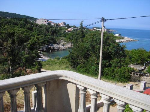 a balcony with a view of the ocean at Apartments Klara in Utjeha