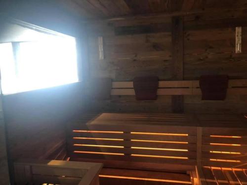 a room with a wooden cabin with a window at Alpenappart in Cadipietra