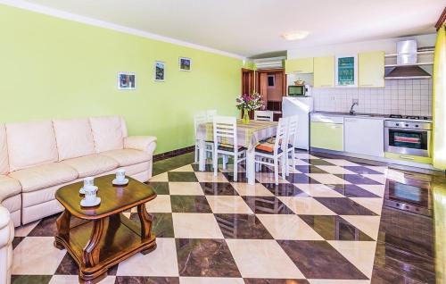 a living room with a couch and a table at Apartments Hari Tisno in Tisno