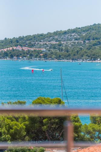 a view of a large body of water with a boat at Apartments Hari Tisno in Tisno