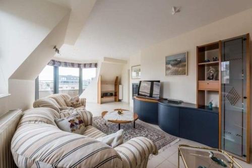 Postel nebo postele na pokoji v ubytování penthouse saint idesbald