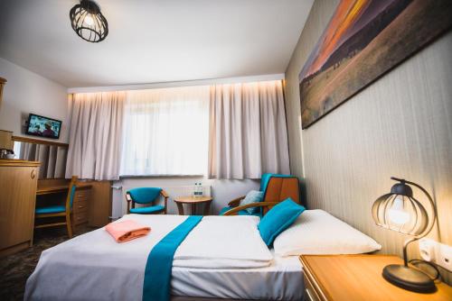 Postel nebo postele na pokoji v ubytování Gościniec Pod Skrzycznem