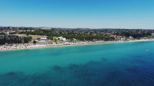 an aerial view of a beach with a group of people at Sea-duction Studios in Nea Iraklia