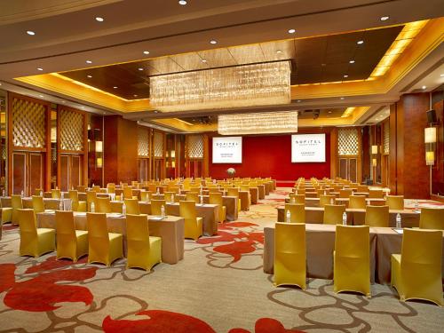 a large room with tables and chairs in it at Sofitel Nanjing Galaxy in Nanjing
