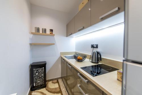 a small kitchen with a sink and a stove at Villa BLUELINE in Alykes Potamou