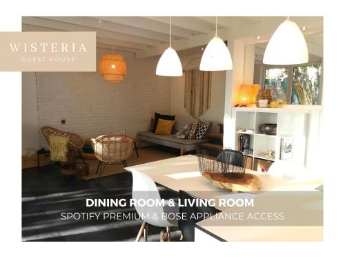 a living room with a dining rooms living room at Wisteria Guest House in Villers-lʼÉvêque