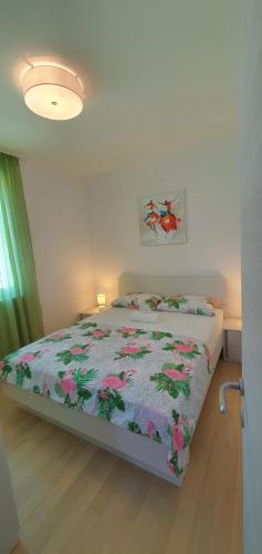 Postel nebo postele na pokoji v ubytování Apartman Galija 1
