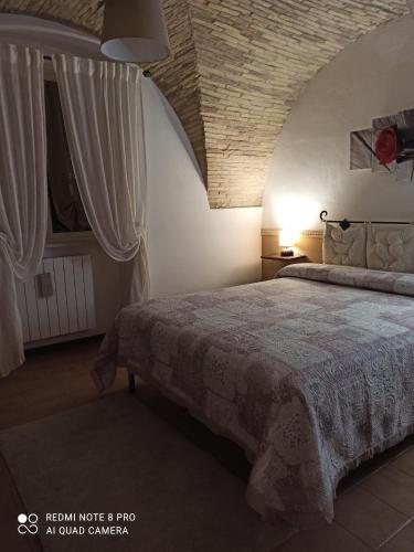 Ένα ή περισσότερα κρεβάτια σε δωμάτιο στο Il Conte di Cavour