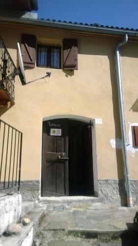 a door in the side of a building at Valprato Soana Casa vacanze in Valprato Soana