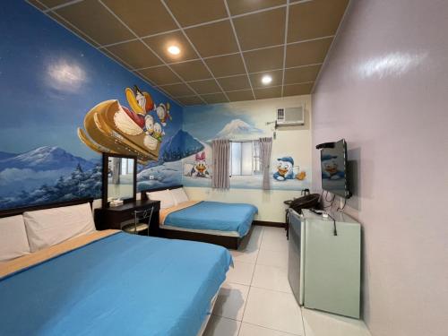 Ein Bett oder Betten in einem Zimmer der Unterkunft Baisha Bay B&B