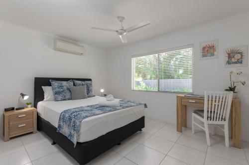 Ένα ή περισσότερα κρεβάτια σε δωμάτιο στο Lychee Tree Holiday Apartments