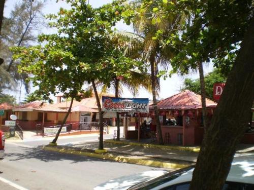 a street with a restaurant on the side of the road at Mar Bonita Beach Appartment II in Isabela