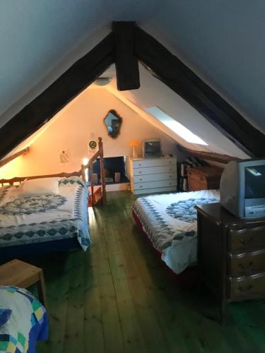 Кровать или кровати в номере Jolie Gîte dans les Pyrénées