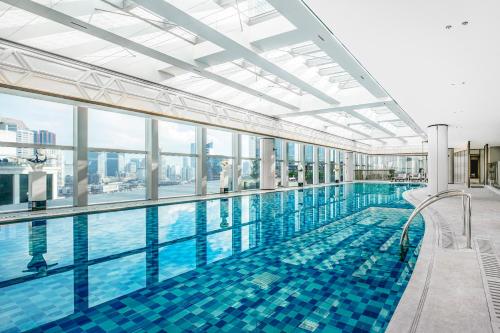 a large swimming pool in a hotel room at Conrad Shanghai in Shanghai