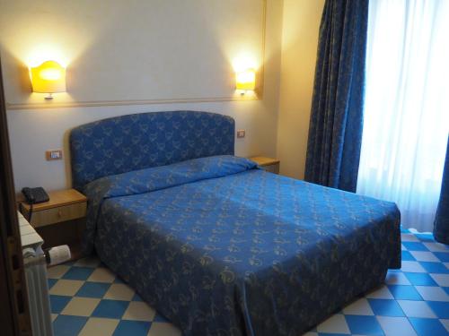 Voodi või voodid majutusasutuse Hotel Locanda Ruscello Garnì toas