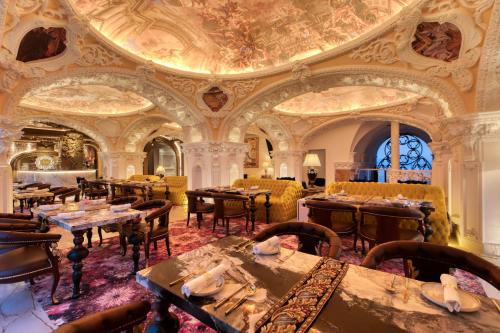 a restaurant with tables and chairs and a ceiling at arte by Thomas Chan in Kuala Lumpur