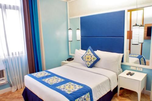 Ένα ή περισσότερα κρεβάτια σε δωμάτιο στο Parque España Residence Hotel