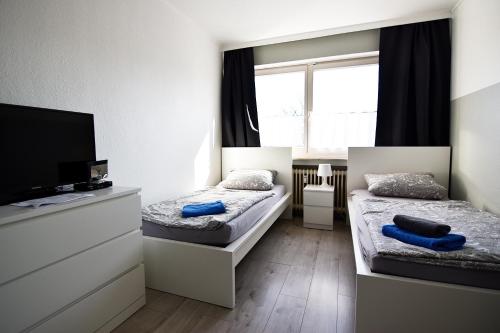 Llit o llits en una habitació de Easy Apartments Work and Stay Cologne