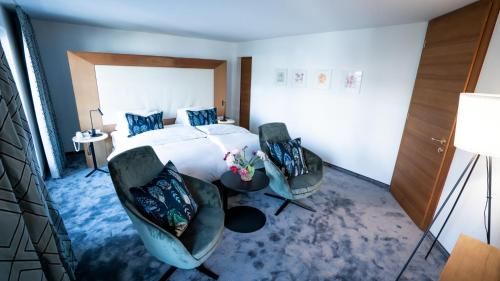 Postel nebo postele na pokoji v ubytování Hotel Christina