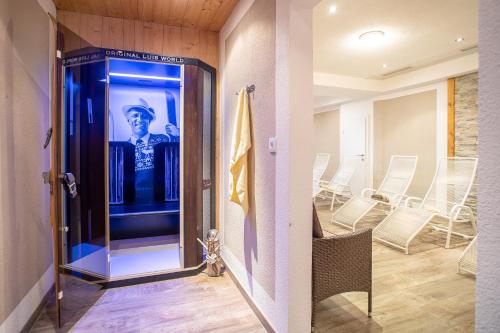 a room with a door with a picture of a man at Camping Inntal in Wiesing