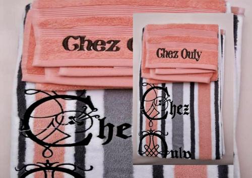 a group of pink towels with the words girls only at Chez Ouly in Dakar