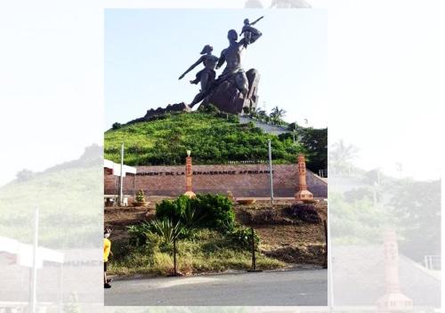 a statue of people on top of a hill at Chez Ouly in Dakar