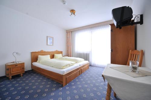 Ein Bett oder Betten in einem Zimmer der Unterkunft Salzburgerhof Jugend- und Familienhotel