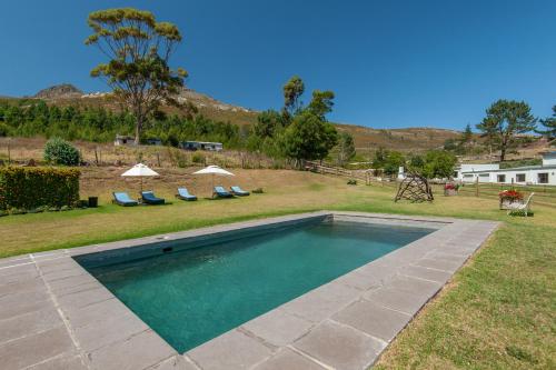 The swimming pool at or close to High Season Farm Luxury Cottages